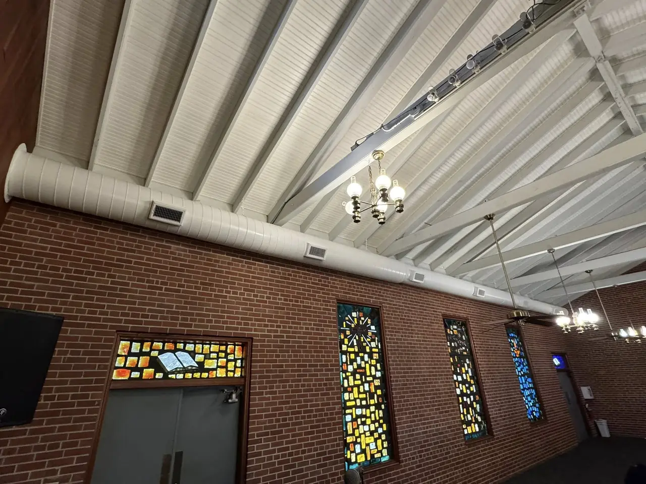 Exposed spiral ductwork installed in a church sanctuary