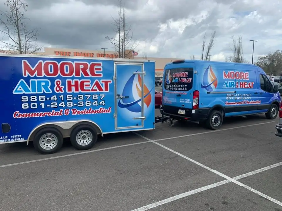 Moore Air & Heat branded trailer and service van